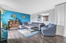 399 Maitland Crescent Ne, Calgary, AB  - Indoor Photo Showing Living Room 