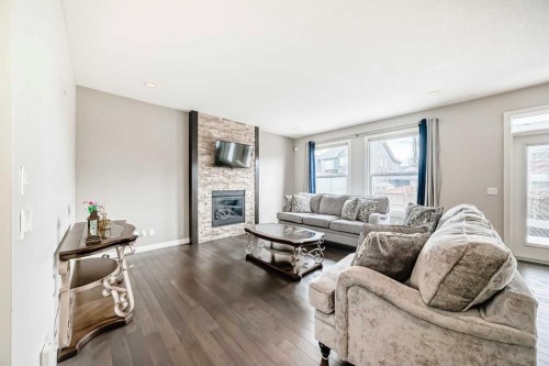 105 Sandpiper Point, Chestermere, AB - Indoor Photo Showing Living Room With Fireplace