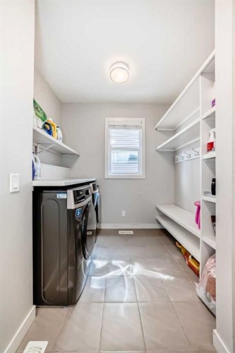 105 Sandpiper Point, Chestermere, AB - Indoor Photo Showing Laundry Room