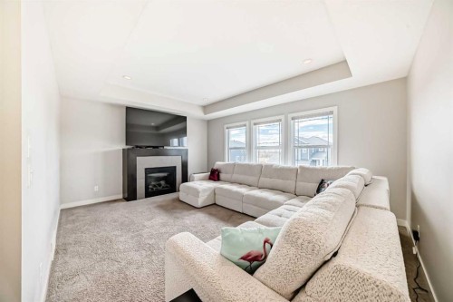 105 Sandpiper Point, Chestermere, AB - Indoor Photo Showing Living Room With Fireplace