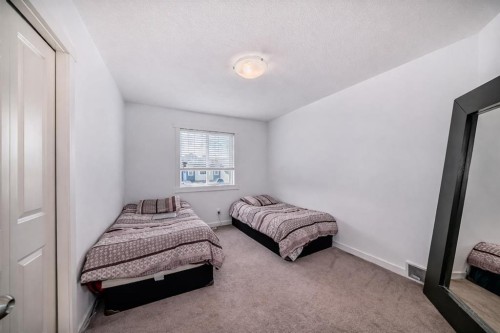 104 Panamount Terrace Nw, Calgary, AB - Indoor Photo Showing Bedroom