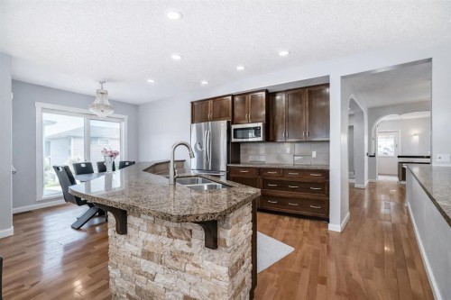 104 Panamount Terrace Nw, Calgary, AB - Indoor Photo Showing Kitchen With Double Sink With Upgraded Kitchen