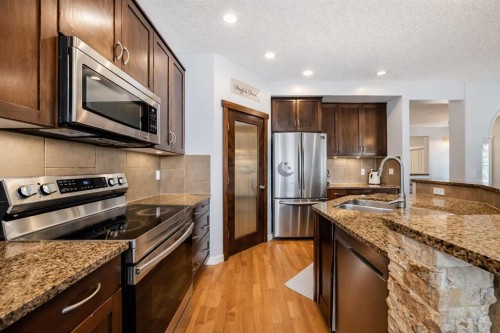 104 Panamount Terrace Nw, Calgary, AB - Indoor Photo Showing Kitchen With Stainless Steel Kitchen With Double Sink With Upgraded Kitchen