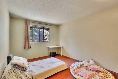 5819 Coach Hill Road Sw, Calgary, AB - Indoor Photo Showing Bedroom