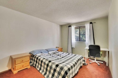5819 Coach Hill Road Sw, Calgary, AB - Indoor Photo Showing Bedroom