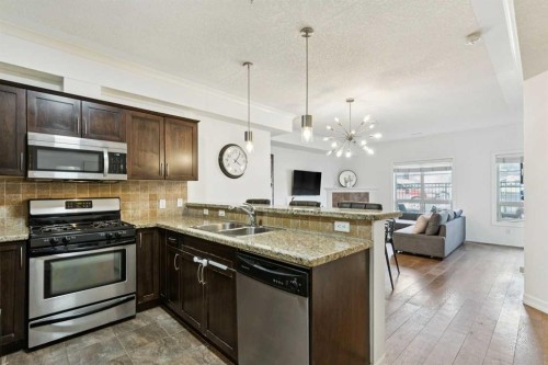 6-1729 34 Avenue Sw, Calgary, AB - Indoor Photo Showing Kitchen With Double Sink