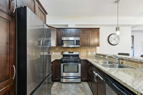 6-1729 34 Avenue Sw, Calgary, AB - Indoor Photo Showing Kitchen With Stainless Steel Kitchen With Double Sink