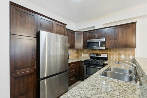 6-1729 34 Avenue Sw, Calgary, AB - Indoor Photo Showing Kitchen With Stainless Steel Kitchen With Double Sink