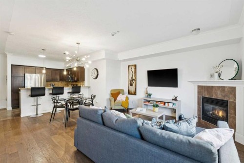 6-1729 34 Avenue Sw, Calgary, AB - Indoor Photo Showing Living Room With Fireplace