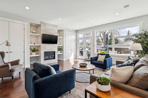 2205 3 Avenue Nw, Calgary, AB - Indoor Photo Showing Living Room With Fireplace