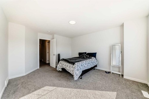 82 Magnolia Court Se, Calgary, AB - Indoor Photo Showing Bedroom
