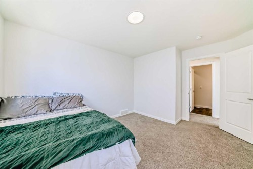 82 Magnolia Court Se, Calgary, AB - Indoor Photo Showing Bedroom