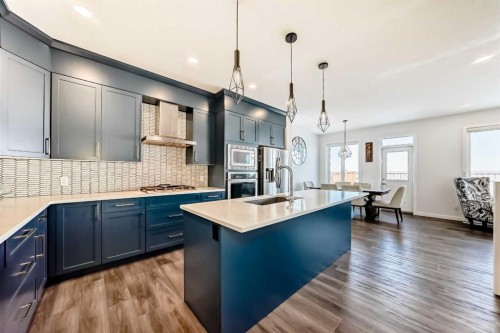 82 Magnolia Court Se, Calgary, AB - Indoor Photo Showing Kitchen With Double Sink With Upgraded Kitchen