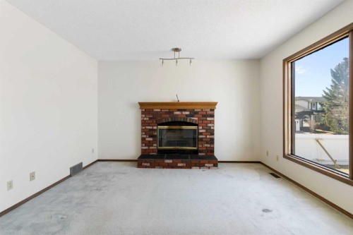 190 Hawkville Close Nw, Calgary, AB - Indoor Photo Showing Living Room With Fireplace