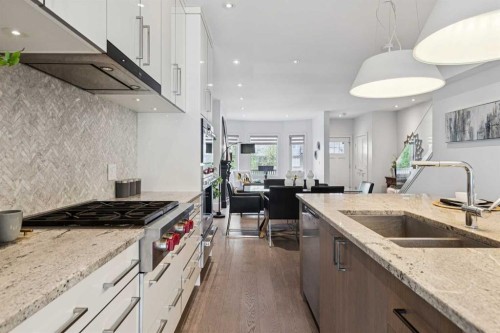 911 18 Avenue Sw, Calgary, AB - Indoor Photo Showing Kitchen With Double Sink With Upgraded Kitchen