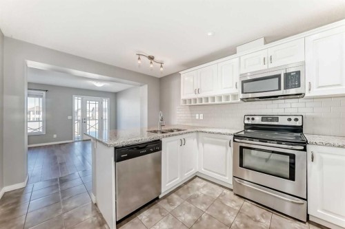 147 Windford Crescent Sw, Airdrie, AB - Indoor Photo Showing Kitchen With Upgraded Kitchen