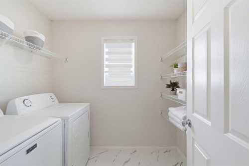 124 Kincora Glen Road Nw, Calgary, AB - Indoor Photo Showing Laundry Room
