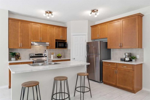 124 Kincora Glen Road Nw, Calgary, AB - Indoor Photo Showing Kitchen With Double Sink