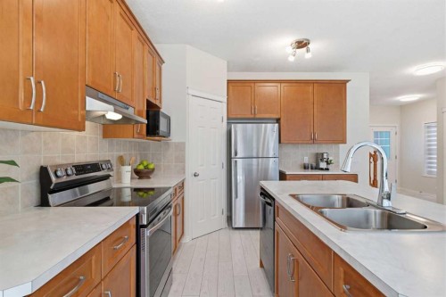 124 Kincora Glen Road Nw, Calgary, AB - Indoor Photo Showing Kitchen With Double Sink