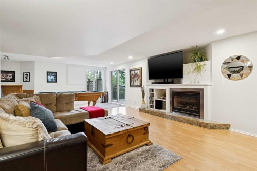 52 Christie Knoll Heights Sw, Calgary, AB - Indoor Photo Showing Living Room With Fireplace