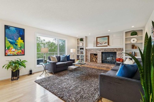 52 Christie Knoll Heights Sw, Calgary, AB - Indoor Photo Showing Living Room With Fireplace