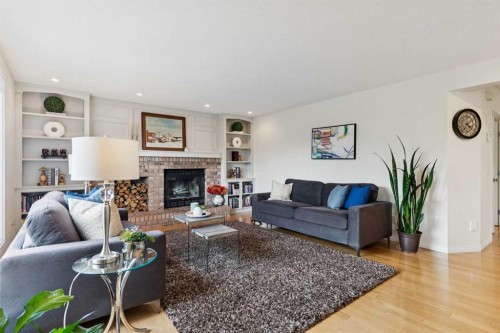 52 Christie Knoll Heights Sw, Calgary, AB - Indoor Photo Showing Living Room With Fireplace