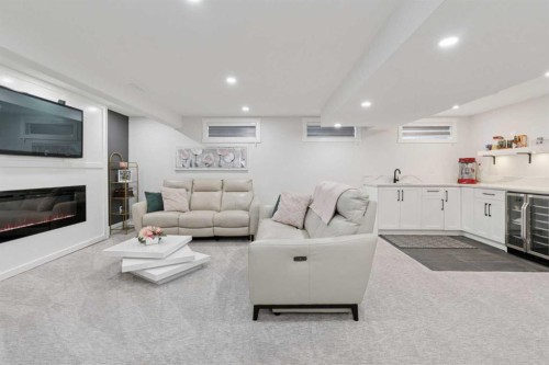 691 Brookpark Drive Sw, Calgary, AB - Indoor Photo Showing Living Room With Fireplace