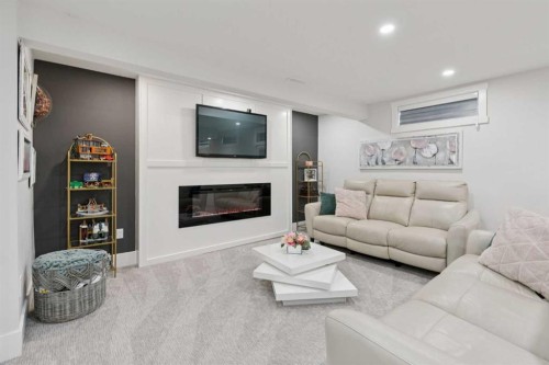691 Brookpark Drive Sw, Calgary, AB - Indoor Photo Showing Living Room With Fireplace