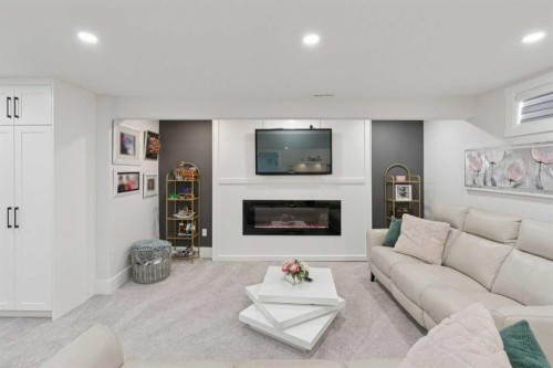 691 Brookpark Drive Sw, Calgary, AB - Indoor Photo Showing Living Room With Fireplace