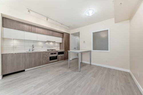 110-51 Waterfront Mews Sw, Calgary, AB - Indoor Photo Showing Kitchen With Upgraded Kitchen