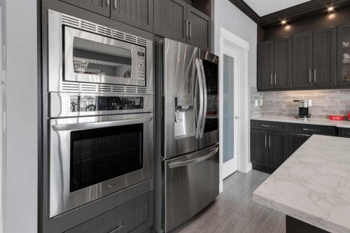 1112 Iron Landing Way, Crossfield, AB - Indoor Photo Showing Kitchen With Stainless Steel Kitchen