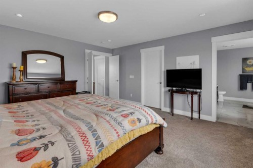 1112 Iron Landing Way, Crossfield, AB - Indoor Photo Showing Bedroom
