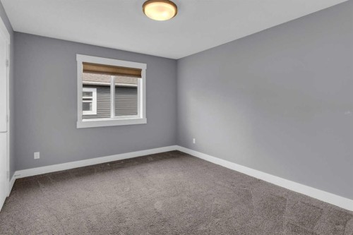 1112 Iron Landing Way, Crossfield, AB - Indoor Photo Showing Other Room