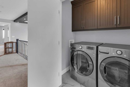 1112 Iron Landing Way, Crossfield, AB - Indoor Photo Showing Laundry Room