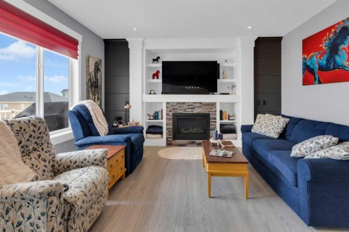 1112 Iron Landing Way, Crossfield, AB - Indoor Photo Showing Living Room With Fireplace