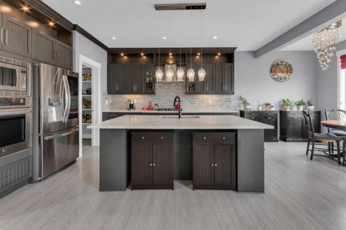 1112 Iron Landing Way, Crossfield, AB - Indoor Photo Showing Kitchen With Stainless Steel Kitchen With Upgraded Kitchen