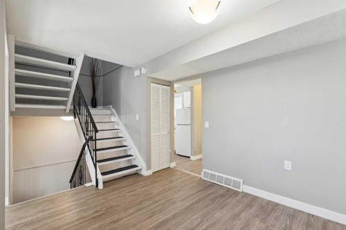 1002-2520 Palliser Drive Sw, Calgary, AB - Indoor Photo Showing Other Room