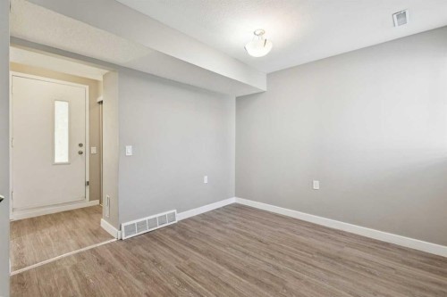 1002-2520 Palliser Drive Sw, Calgary, AB - Indoor Photo Showing Other Room