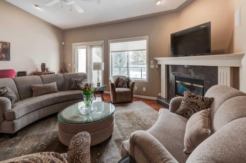 180 Sierra Morena Landing Sw, Calgary, AB - Indoor Photo Showing Living Room With Fireplace