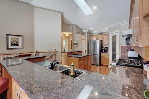 180 Sierra Morena Landing Sw, Calgary, AB - Indoor Photo Showing Kitchen With Stainless Steel Kitchen With Double Sink With Upgraded Kitchen