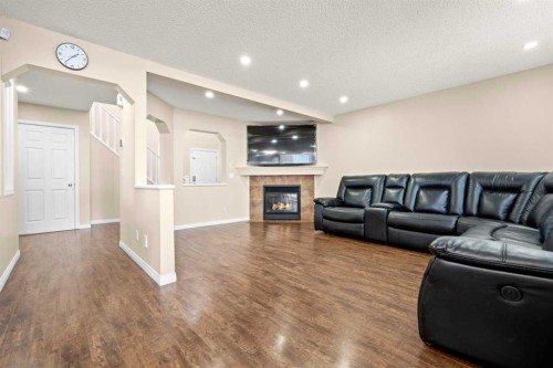 332 Oakmere Way, Chestermere, AB - Indoor Photo Showing Living Room With Fireplace