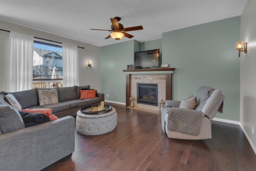 69 Morningside Circle Sw, Airdrie, AB - Indoor Photo Showing Living Room With Fireplace