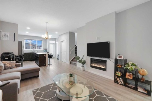 32 Seton Row Se, Calgary, AB - Indoor Photo Showing Living Room With Fireplace