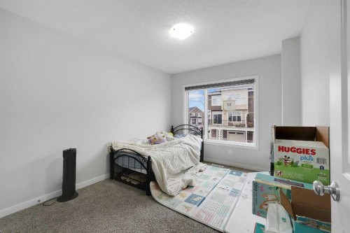 32 Seton Row Se, Calgary, AB - Indoor Photo Showing Bedroom