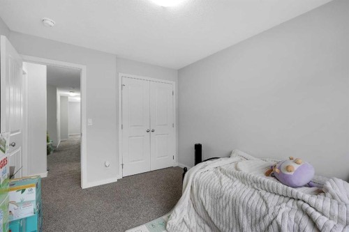 32 Seton Row Se, Calgary, AB - Indoor Photo Showing Bedroom