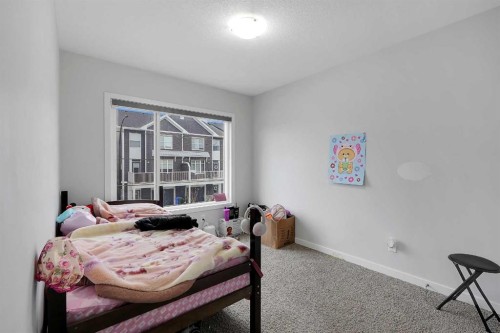 32 Seton Row Se, Calgary, AB - Indoor Photo Showing Bedroom