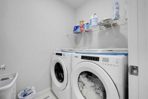 32 Seton Row Se, Calgary, AB - Indoor Photo Showing Laundry Room