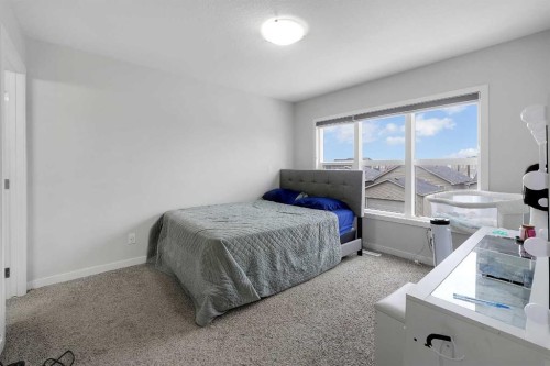 32 Seton Row Se, Calgary, AB - Indoor Photo Showing Bedroom
