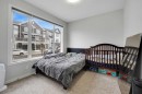 32 Seton Row Se, Calgary, AB  - Indoor Photo Showing Bedroom 