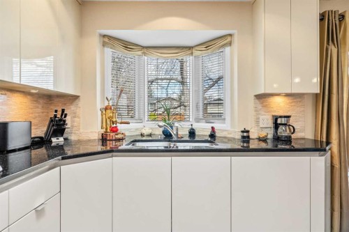 91 Sun Valley Drive Se, Calgary, AB - Indoor Photo Showing Kitchen With Double Sink